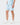 Front 3/4 of the Topographic Blue Momentum Shorts on a model in front of a light gray background.