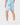 Back of the Topographic Blue Momentum Shorts on a model in front of a light gray background.