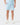 Front of the Topographic Blue Momentum Shorts on a model in front of a light gray background.
