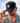 Model wearing the Tortuga Hat doing a hat tilt with blue sky as the background
