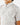 Close up on the left chest pocket on the Traveler Outpost Button-Down Shirt on a model in front of a light gray background.