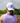 Model wearing the Two Steppin' Flight Hat on the golf course with greenery & Blue sky in the background