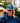 Model wearing the Upstream Waxed Canvas hat outside with greenery in the background.
