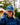 Model wearing the Upstream Waxed Canvas hat outside with greenery in the background.