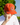 A male model wearing the WWR Rope Hat outside with greenery in the background