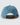Back of the Waggle Waltz Denim Hat in front of a light gray background.