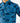 Close up on the left chest pocket on the Wake Life Outpost Button-Down Shirt on a model in front of a light gray background.