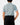 Back of the Want S'More Polo tucked in on a model in front of a light gray background.