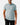 Front of the Want S'More Polo on a model in front of a light gray background.