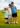 3 boys standing together and smiling on a golf course