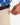 Close up on the Zippered pocket on the left leg of the Ace Pants on a model in front of a white background