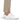Close up on the ankle slit on the Rhythm Pants on a model in front of a white background