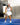 Model wearing the White Matchplay Mock Neck while playing pickleball.