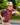 Model wearing the Wild Side Boy's Polo running around a playground with trees in the background