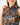 Close up on the collar of the Wildflower Way Sleeveless Polo on a model in front of a light gray background.