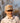 Model wearing the Youth Wingman Hat on the golf course with trees in the background.