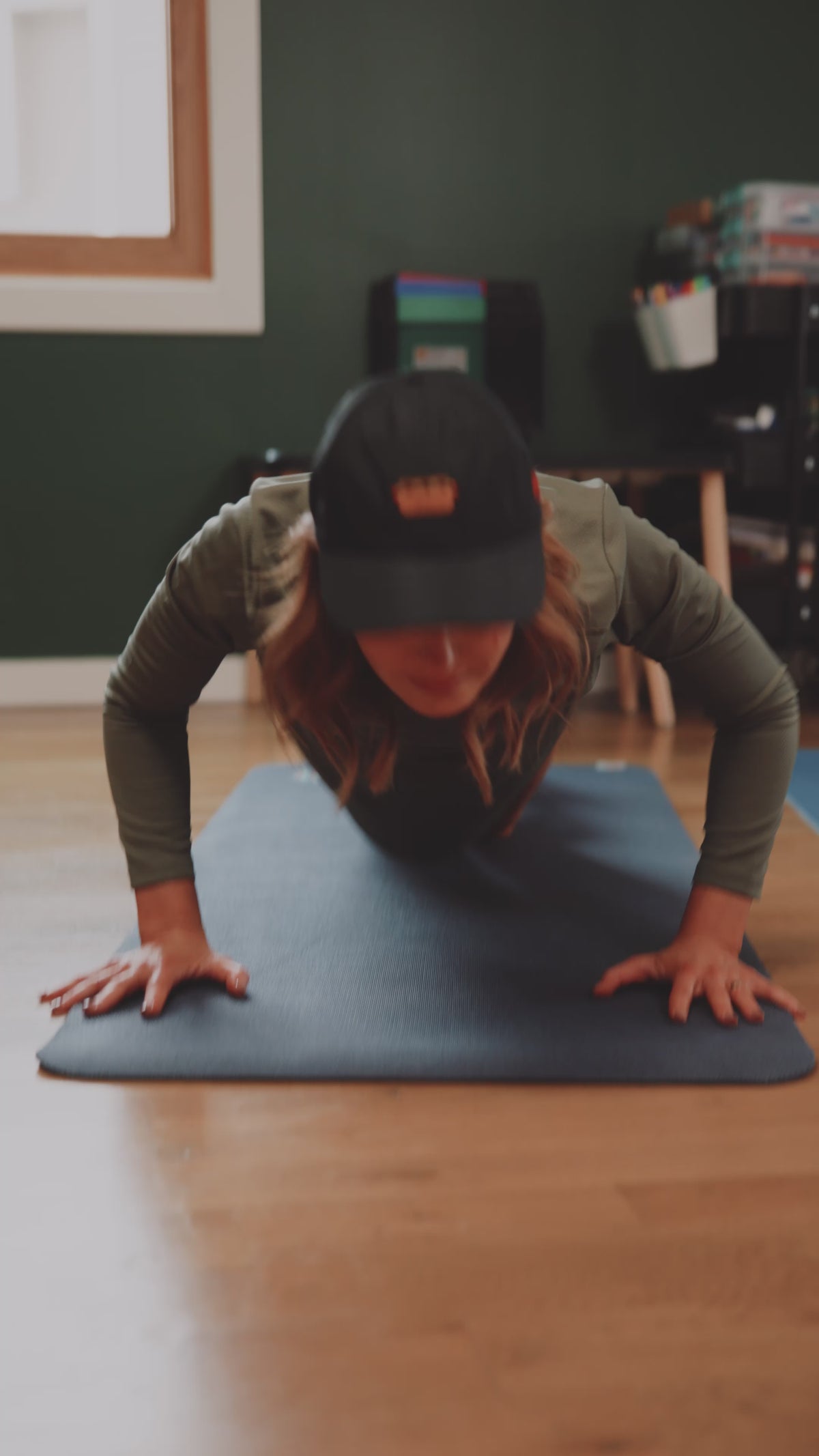Video with husband, wife, and kids getting ready in the morning. All wearing hats and activewear.
